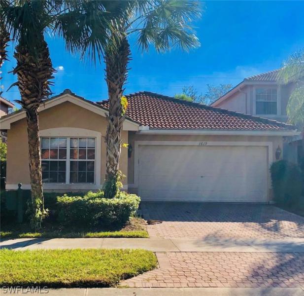 1619 Triangle Palm TER Naples, FL 34119 photo 2